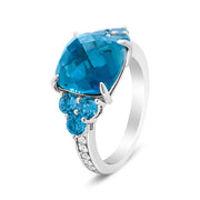 Bids.com 18K White Gold 10mm Cushion Shaped Blue Topaz and 1/6 Cttw Diamond 3 Stone Style Ring (F-G Color, VS1-VS2 Clarity) - Ring Size 6.5 Rings