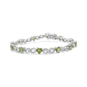 Bids.com .925 Sterling Silver 1.00 Cttw Diamond and 4.00mm Lab Created Green Heart-Shaped Peridot Infinity Link Bracelet (I-J Color, I2-I3 Clarity) - 7.25" Bracelets