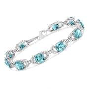 Bids.com .925 Sterling Silver 7x7 mm Cushion Cut Blue Topaz and 1/20 cttw Round Cut Diamond Fashion Tennis Bracelet (I-J Color, I1-I2 Clarity) - 7" Bracelets