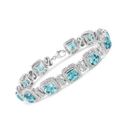 Bids.com .925 Sterling Silver 7x7 mm Cushion Cut Blue Topaz and 1/10 Ctw Single Cut Diamond Square Shape Tennis Bracelet (I-J Color, I1-I2 Clarity) - 7" Bracelets