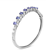 Bids.com 14K White Gold 5 MM Oval Blue Tanzanite and 1/4 Cttw Diamond Bangle (H-I Color, VS2-SI1 Clarity) - Fits wrists up to 7 1/2 Inches Bracelets