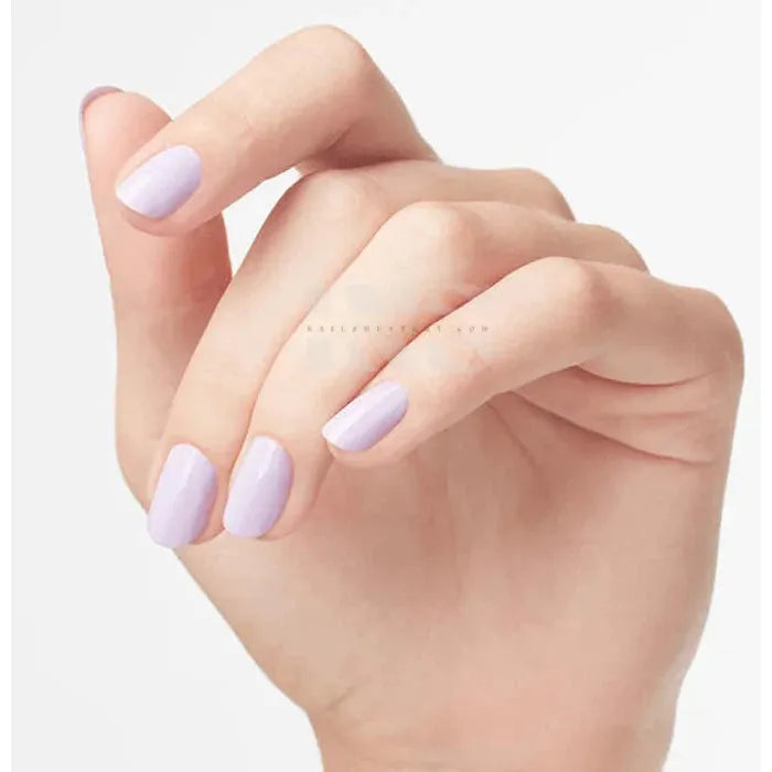 hand with Nail polish fiji spring color on