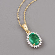 Bids.com 1.36 Carat Genuine Zambian Emerald and White Diamond 10K Yellow Gold Pendant Pendants