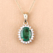 Bids.com 1.36 Carat Genuine Zambian Emerald and White Diamond 10K Yellow Gold Pendant Pendants