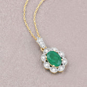 Bids.com 0.79 Carat Genuine Zambian Emerald and White Diamond 10K Yellow Gold Pendant Pendants